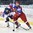 POPRAD, SLOVAKIA - APRIL 20: Russia's Ivan Muranov #23 carries the puck while Slovakia's Marek Korencik #5 stick checks hm during quarterfinal round action at the 2017 IIHF Ice Hockey U18 World Championship. (Photo by Andrea Cardin/HHOF-IIHF Images)